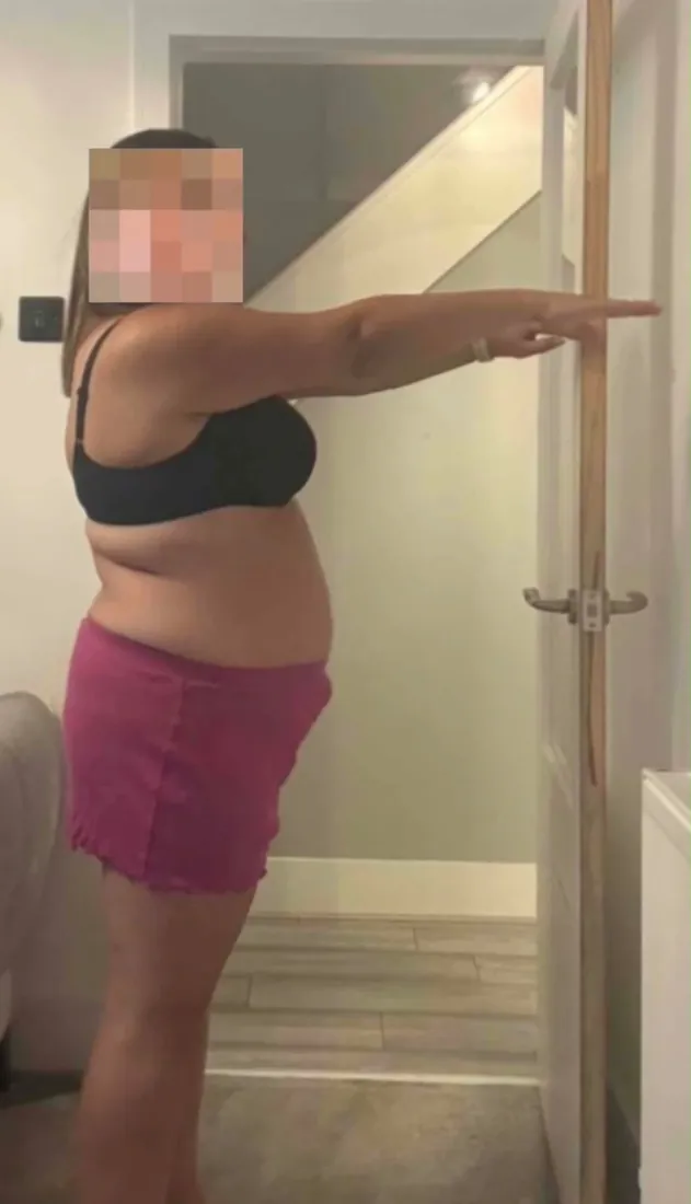 Amy before starting coaching, side view