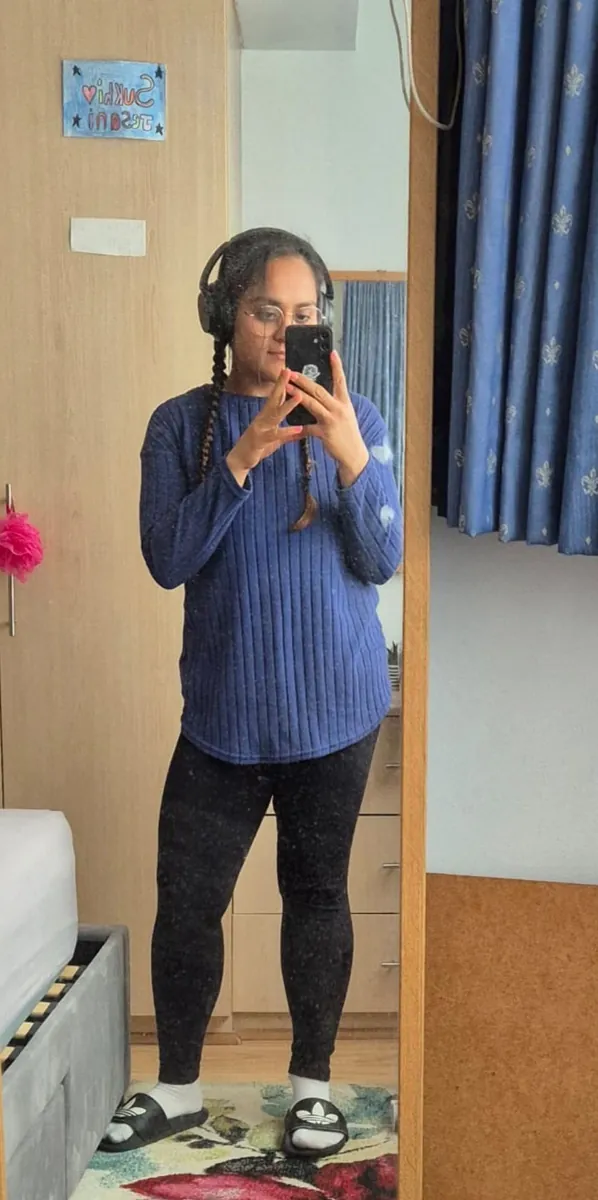 Pooja after coaching, mirror selfie