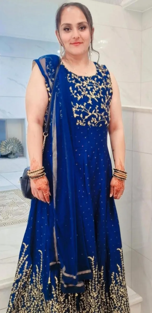 Pooja after losing 50kg, in a blue lehenga